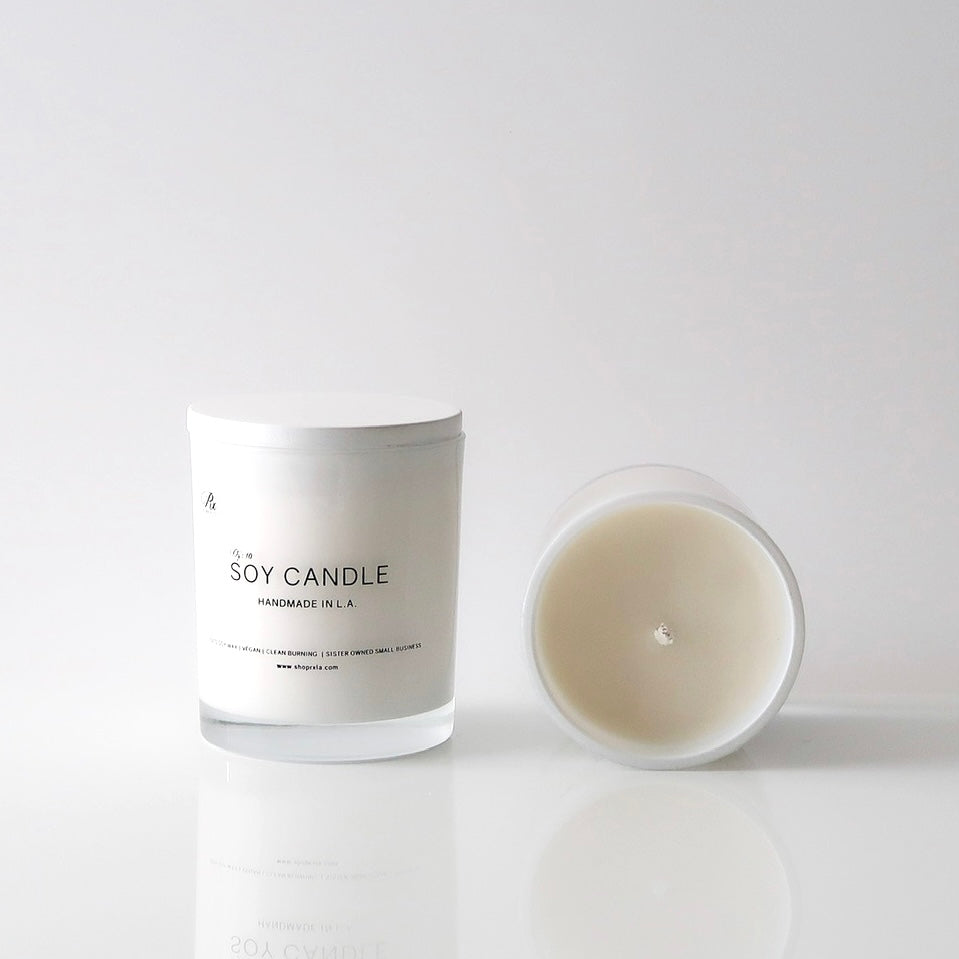 RXLA Ambre scented candle—crafted with non-toxic soy wax for a cozy, relaxing atmosphere with rich amber and musky notes.