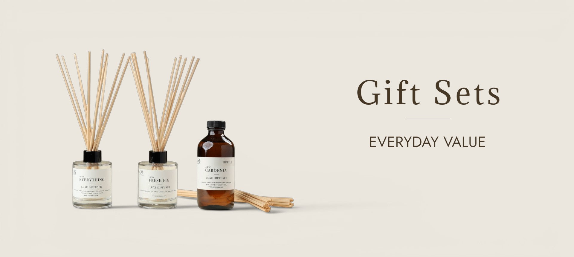 Two white soy candles in  glass jars with white lids are shown in front of their matching white packaging boxes. The labels read Soy Candle Handmade in LA'.