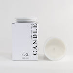 Candle packaging with a white candle on a light gray background