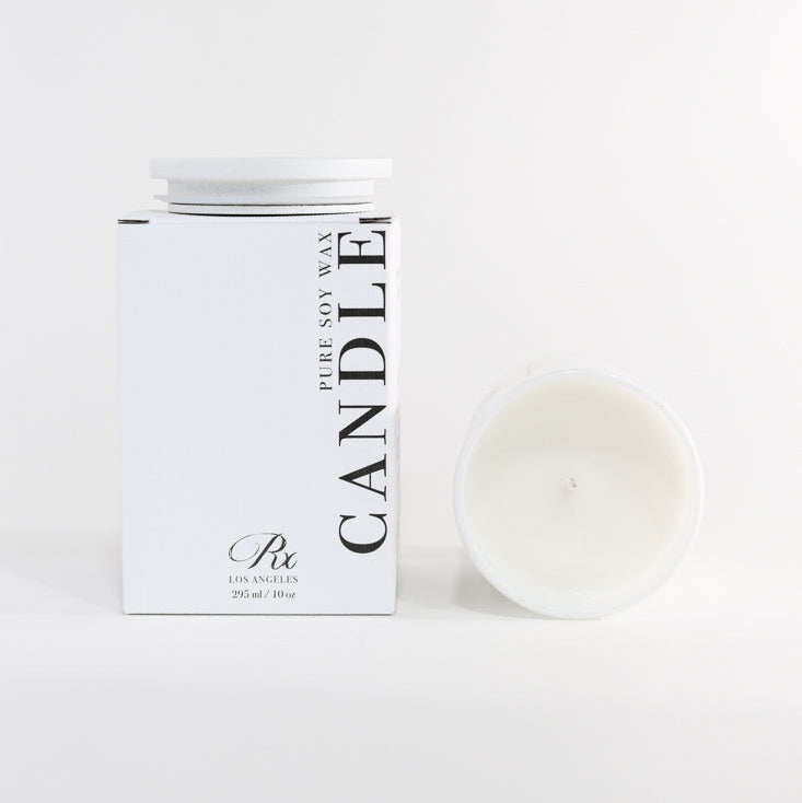 Candle with packaging on a white background
