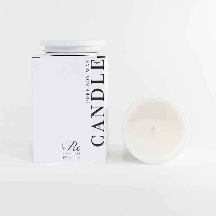 Candle with packaging on a white background