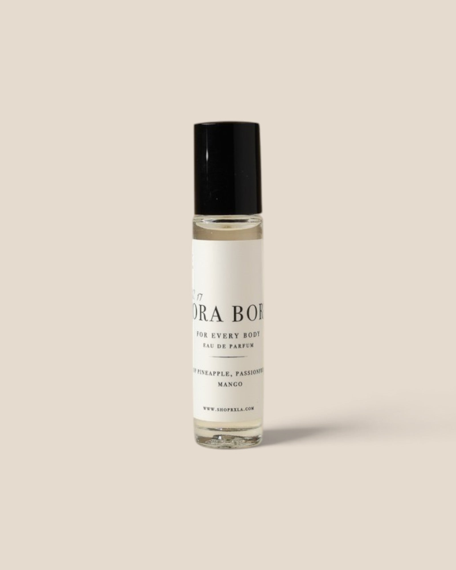 A clear glass rollerball bottle with a black cap and a white label 