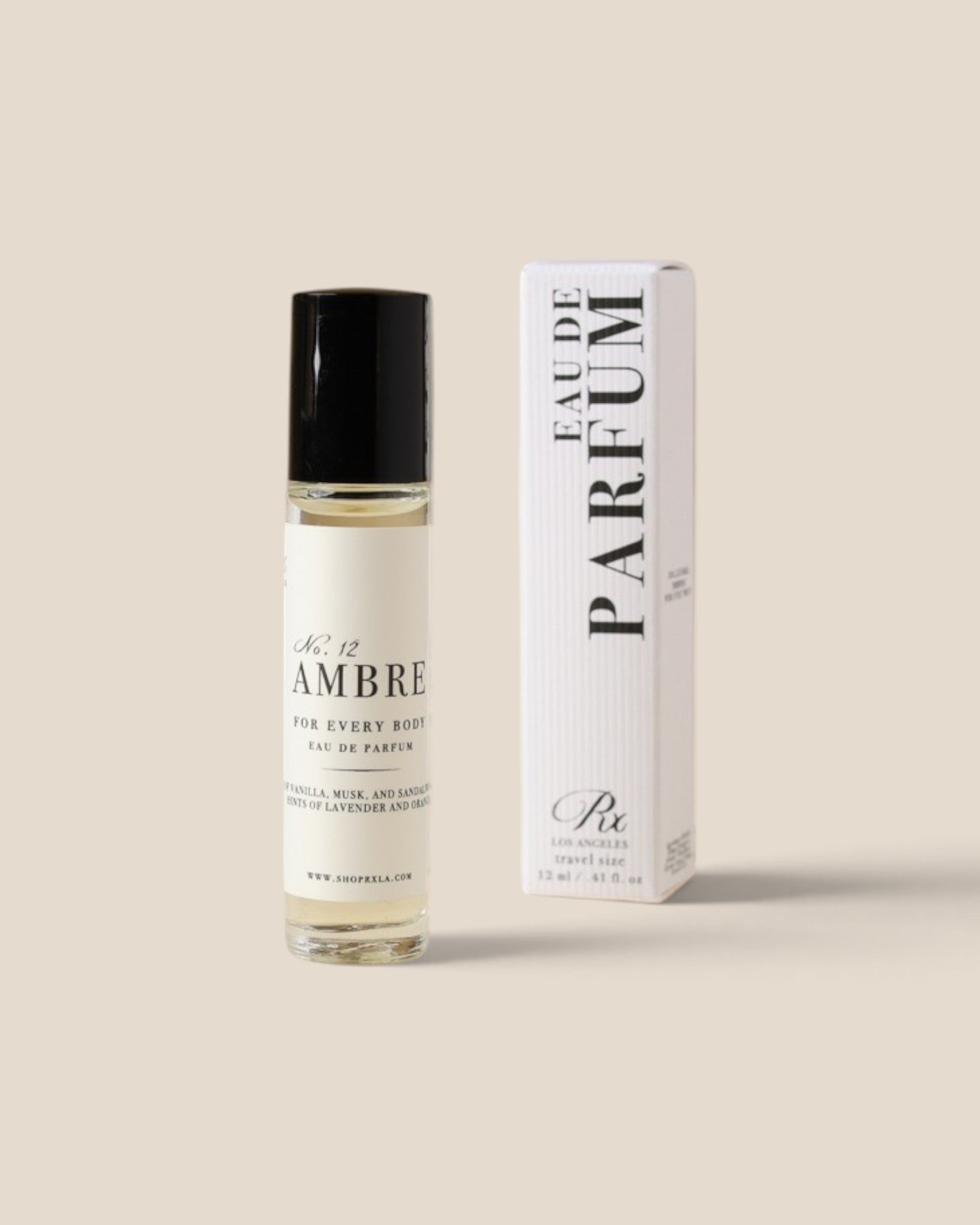 A clear glass rollerball perfume bottle with a black cap 