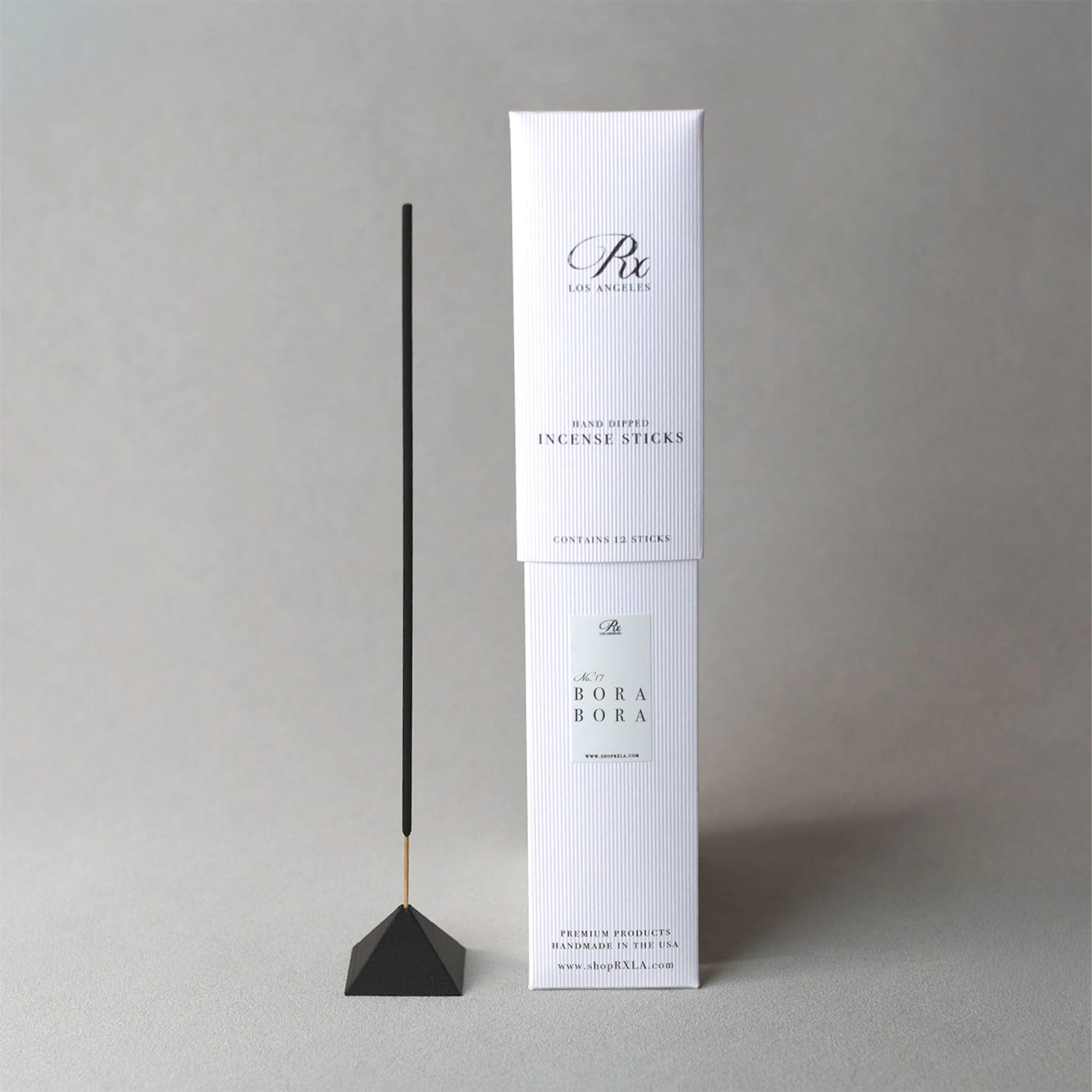 Incense stick with packaging on a gray background