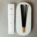 Incense sticks with packaging on a gray background