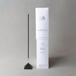 Incense stick with packaging on a gray background