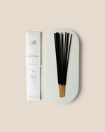 A boxed set of incense sticks shown on a warm beige background. The white rectangular box is labeled 'Ranieri' and 'White Lotus'.